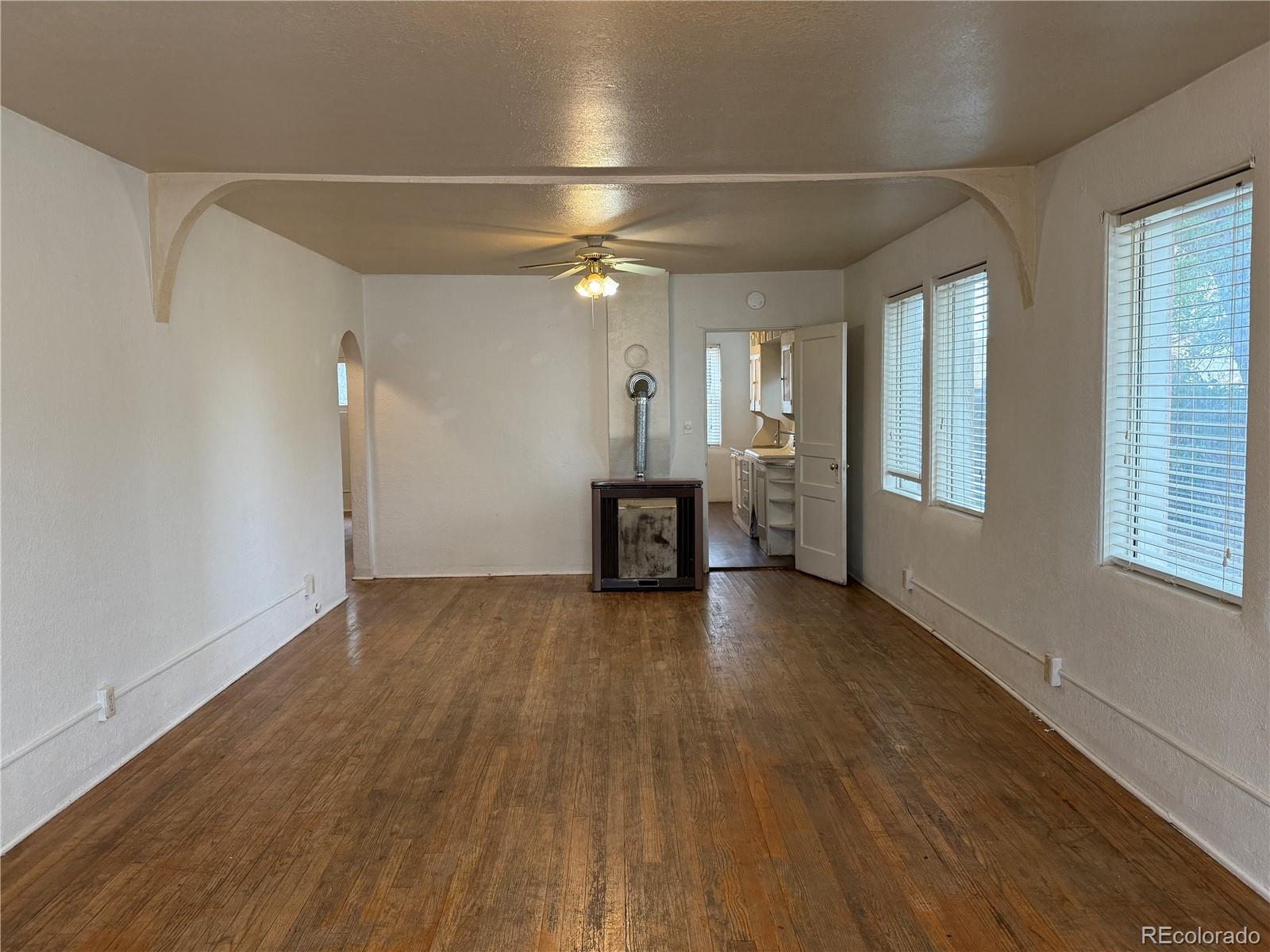 134 West 3rd Street Center, CO 81125 - Photo 2 of 13 a view of a livingroom with wooden floor