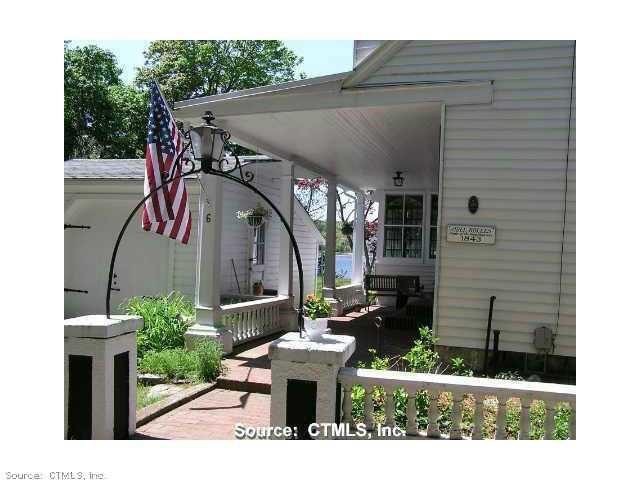 6 Riverside Place Ledyard, CT 06335 - Photo 1 of 1 Exterior Front. Open porch covers Main Entrance, side door to garage. On Historic Register.