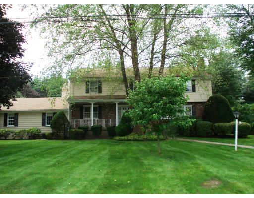 141 Worthen Road Lexington, MA 02421 - Photo 1 of 21 a front view of house with a garden