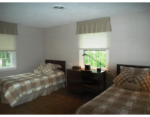 141 Worthen Road Lexington, MA 02421 - Photo 14 of 21 a bedroom with a bed and a window