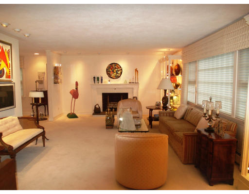 141 Worthen Road Lexington, MA 02421 - Photo 2 of 21 a living room with furniture and a fireplace