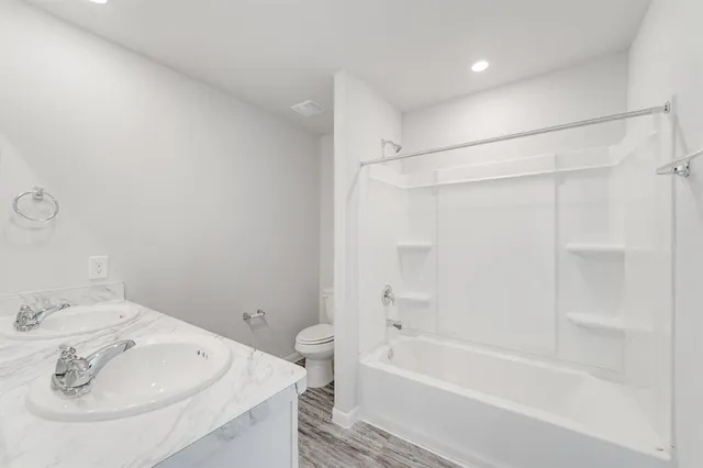 a bathroom with a bathtub and a sink