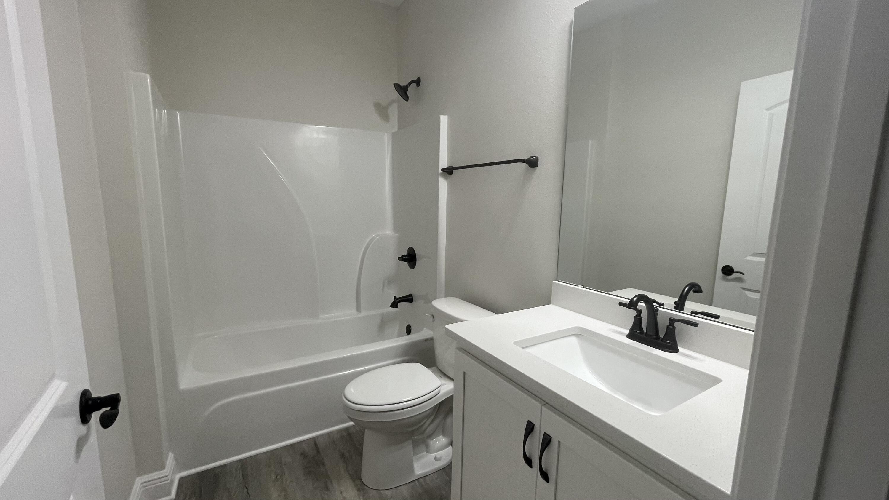116 Bear Creek Boulevard Freeport, FL 32439 - Photo 11 of 16 a bathroom with a sink a toilet and shower