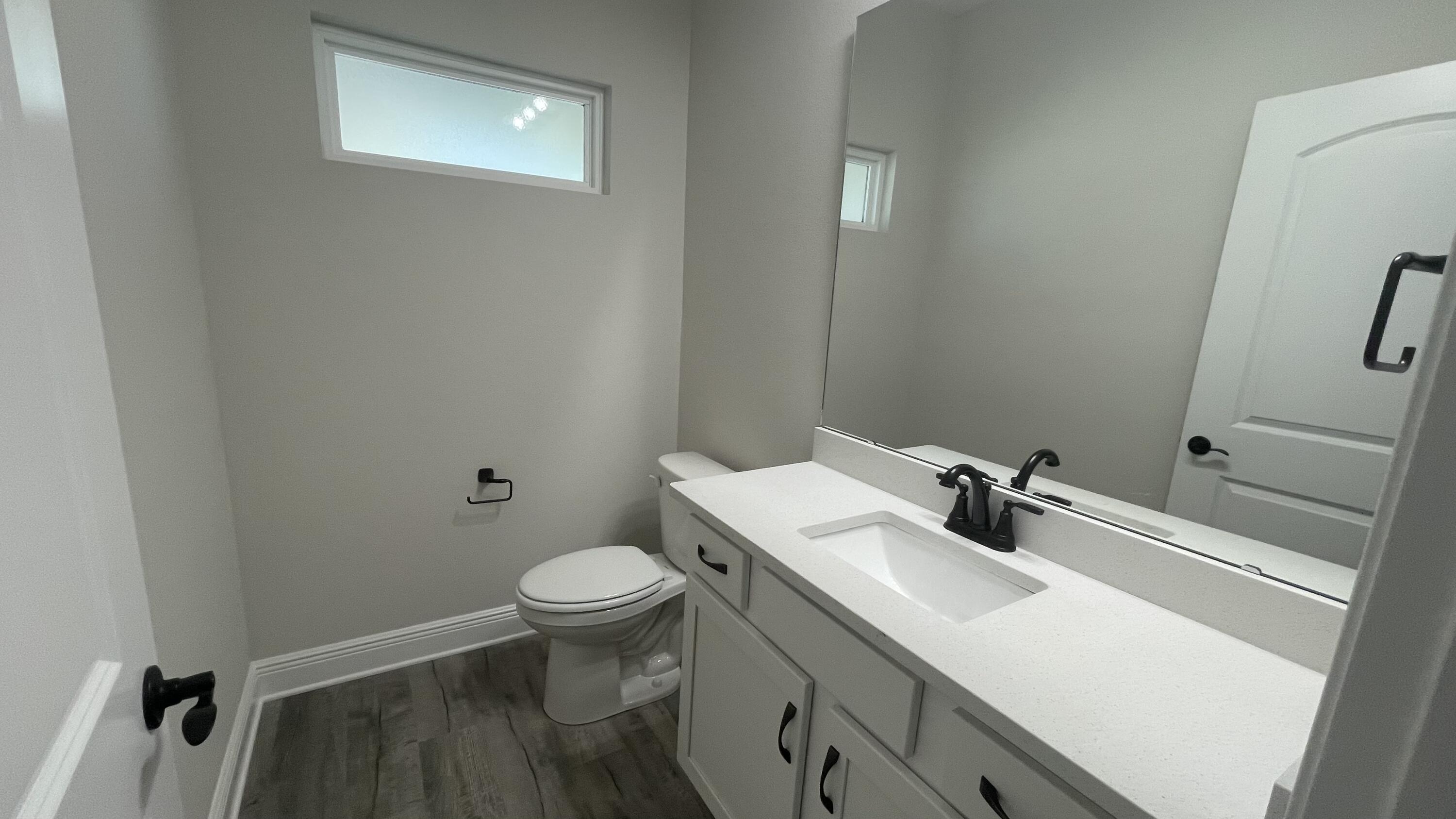 116 Bear Creek Boulevard Freeport, FL 32439 - Photo 13 of 16 a bathroom with a sink and a toilet