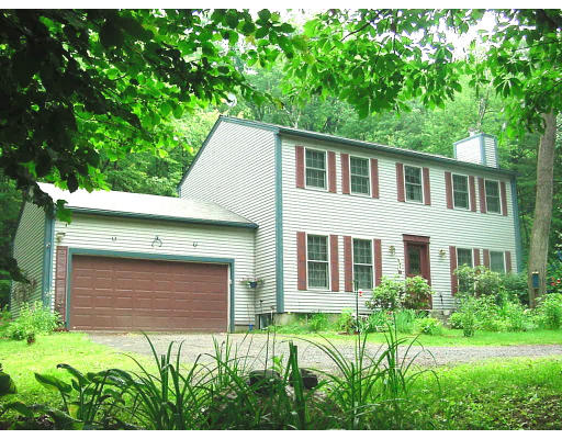 98 Ripley Road Montague, MA 01351 - Photo 1 of 3 a front view of a house with a garden