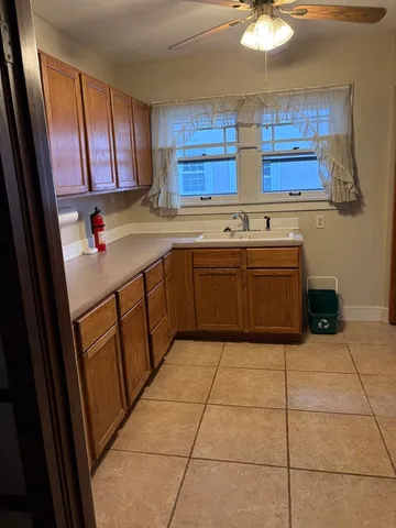 a kitchen with stainless steel appliances granite countertop a sink and cabinets