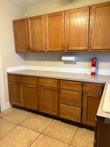 a kitchen with a sink and cabinets