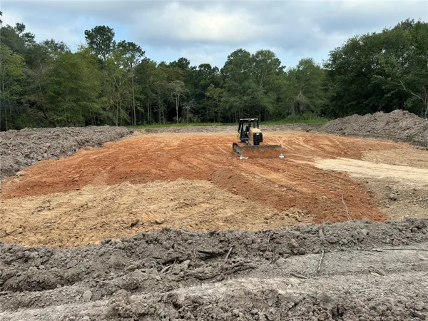 a view of a backyard of the house