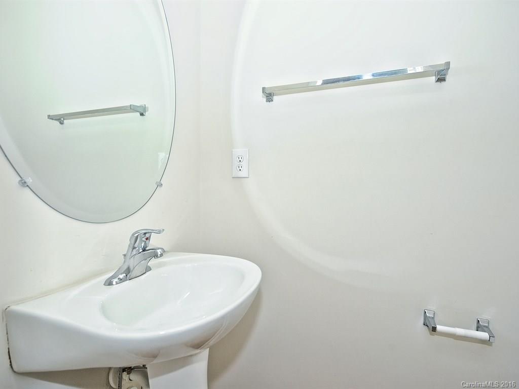4142 Walker Road, Unit 4142 Charlotte, NC 28211 - Photo 12 of 22 a bathroom with a sink and a mirror