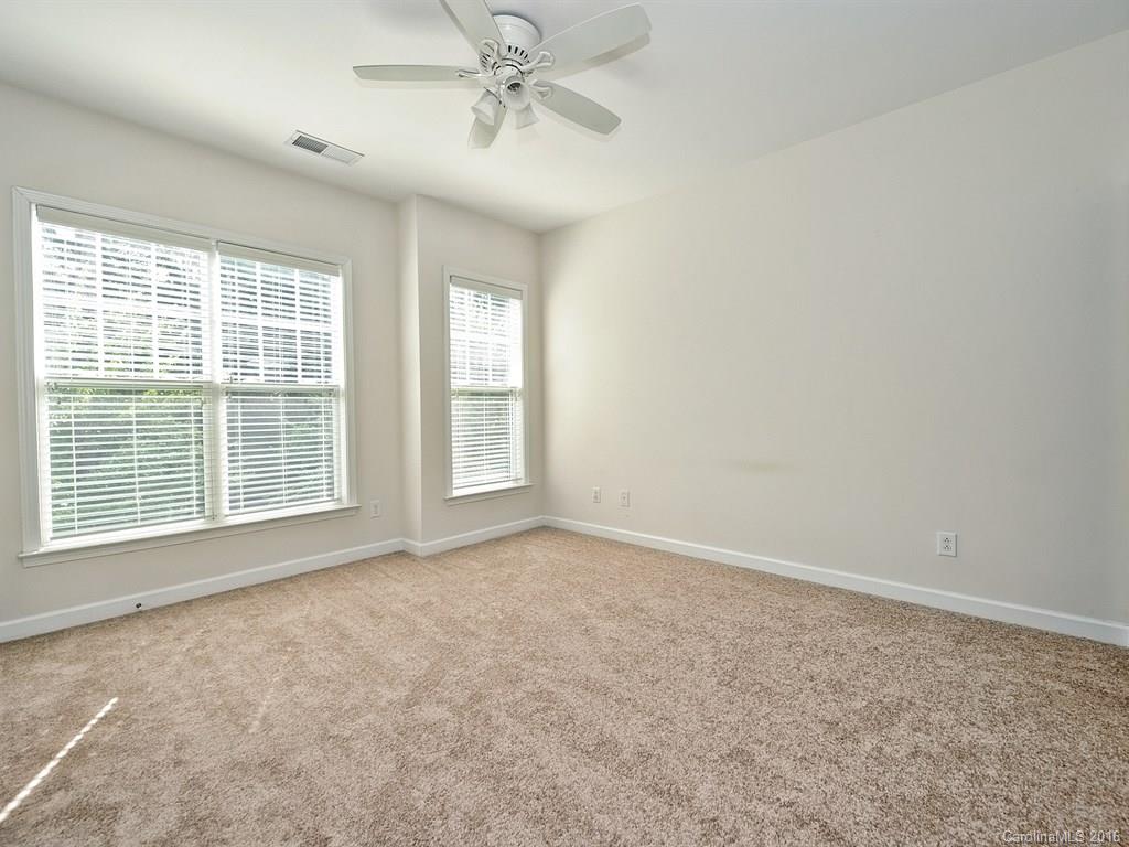 4142 Walker Road, Unit 4142 Charlotte, NC 28211 - Photo 13 of 22 a view of an empty room with a window
