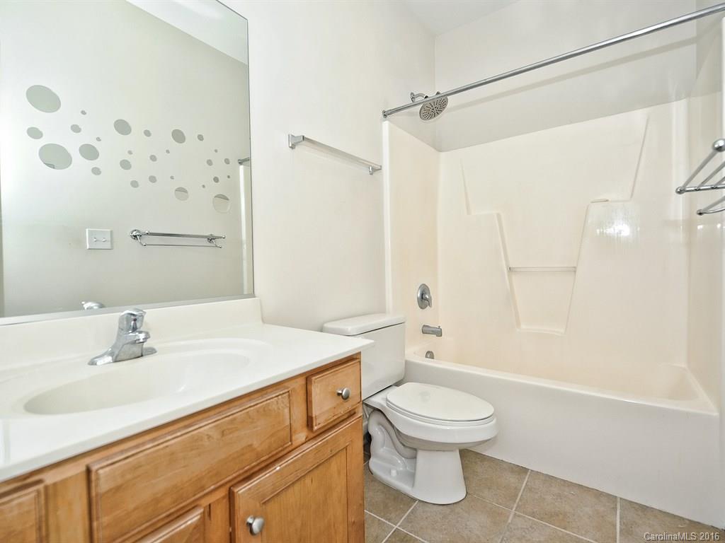 4142 Walker Road, Unit 4142 Charlotte, NC 28211 - Photo 15 of 22 a bathroom with a sink toilet and shower