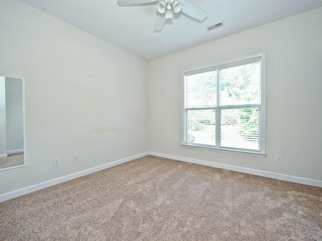 4142 Walker Road, Unit 4142 Charlotte, NC 28211 - Photo 17 of 22 an empty room with a window