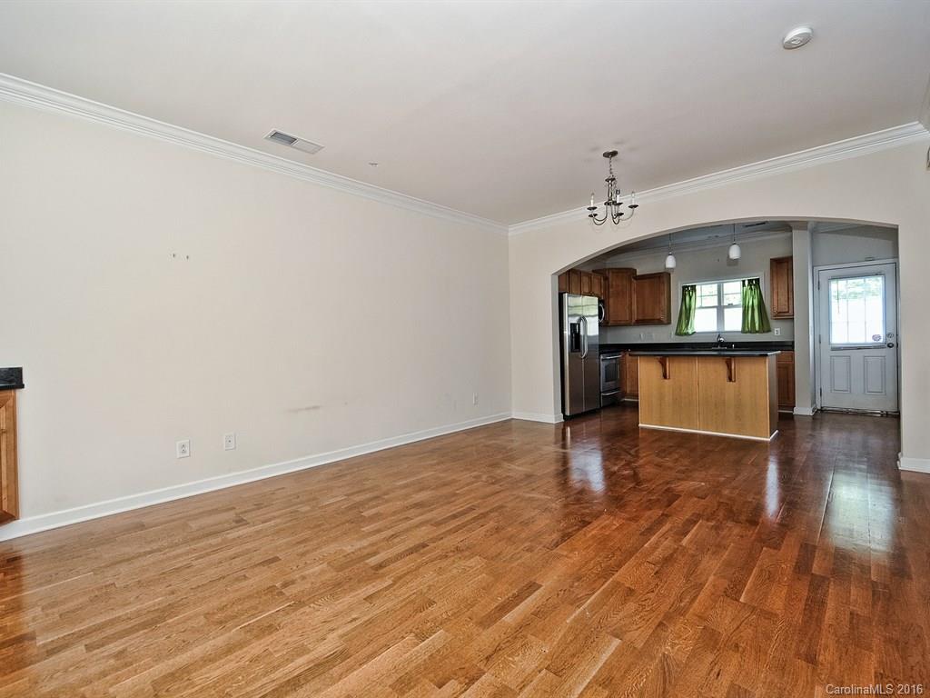 4142 Walker Road, Unit 4142 Charlotte, NC 28211 - Photo 3 of 22 wooden floor in an empty room with a window