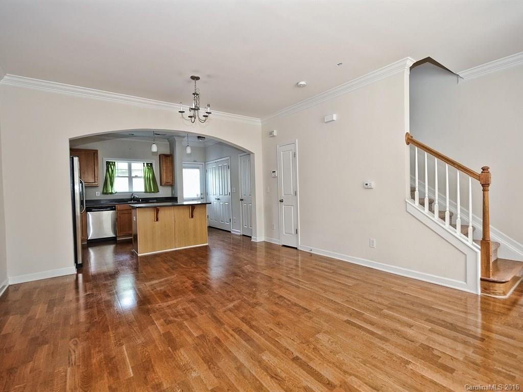 4142 Walker Road, Unit 4142 Charlotte, NC 28211 - Photo 4 of 22 wooden floor in an empty room with a window