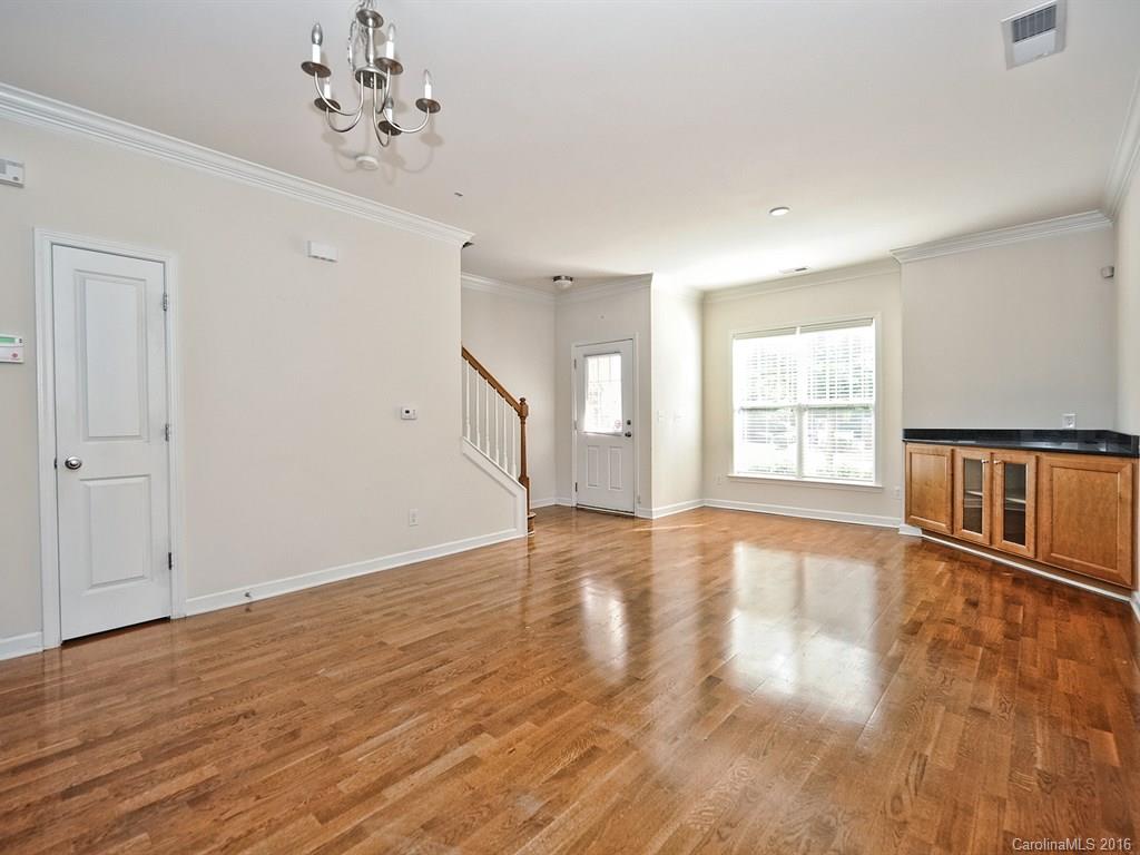 4142 Walker Road, Unit 4142 Charlotte, NC 28211 - Photo 6 of 22 wooden floor in an empty room with a window
