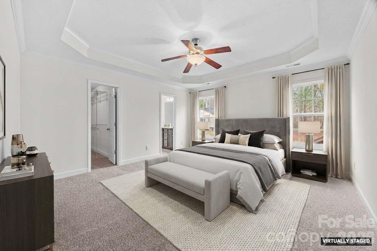 6115 Chandler Road Clover, SC 29710 - Photo 18 of 36 a bedroom with bed and a chandelier