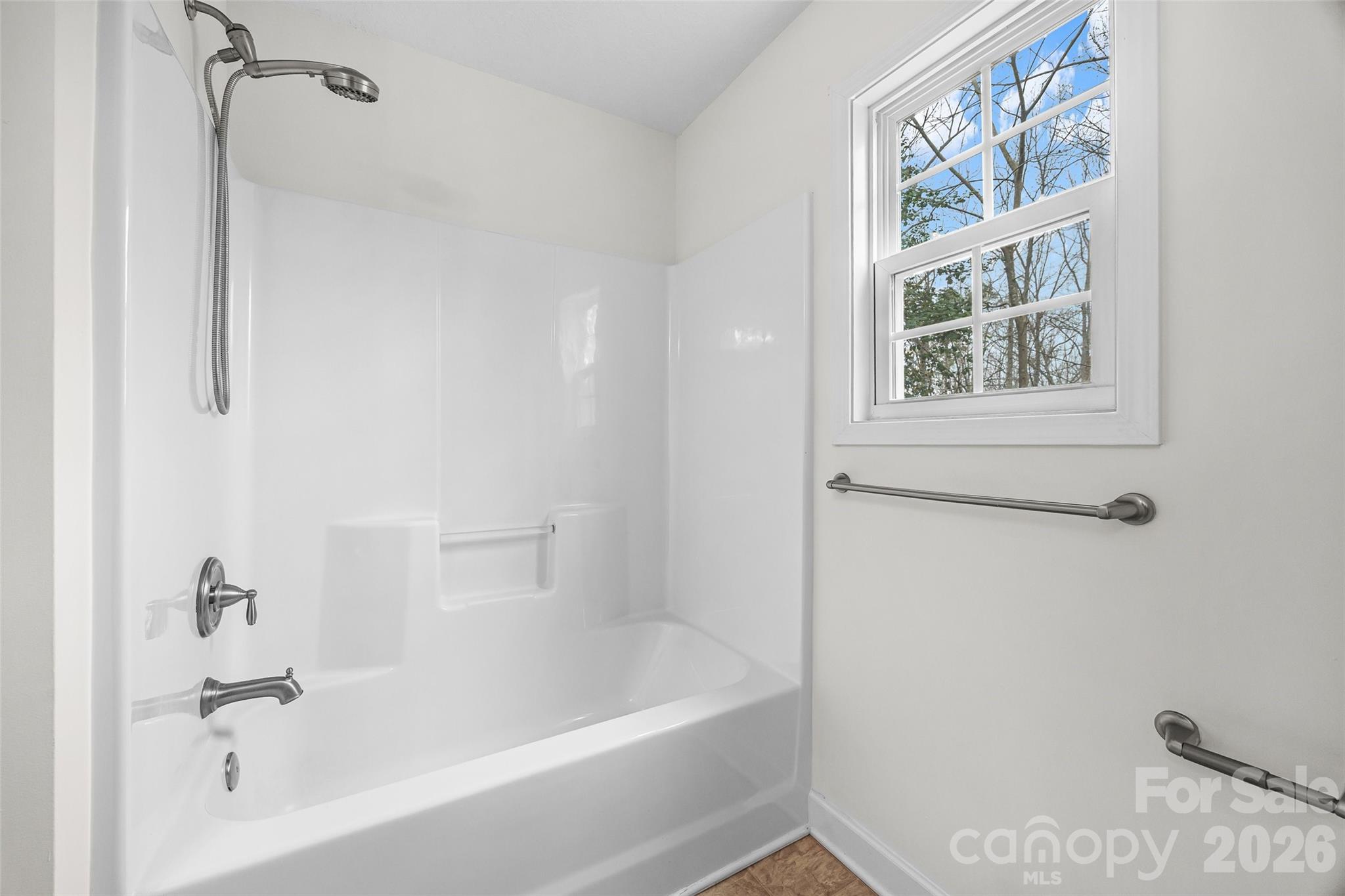 6115 Chandler Road Clover, SC 29710 - Photo 29 of 36 a white bath tub with a shower