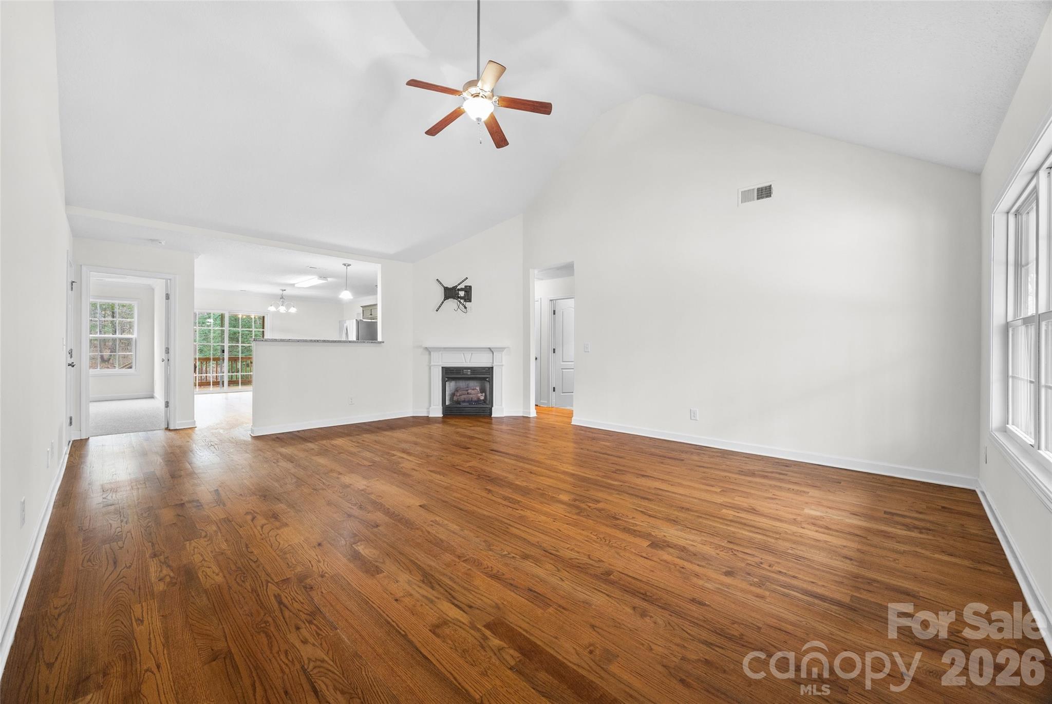 6115 Chandler Road Clover, SC 29710 - Photo 5 of 36 a view of empty room with wooden floor and ceiling fan