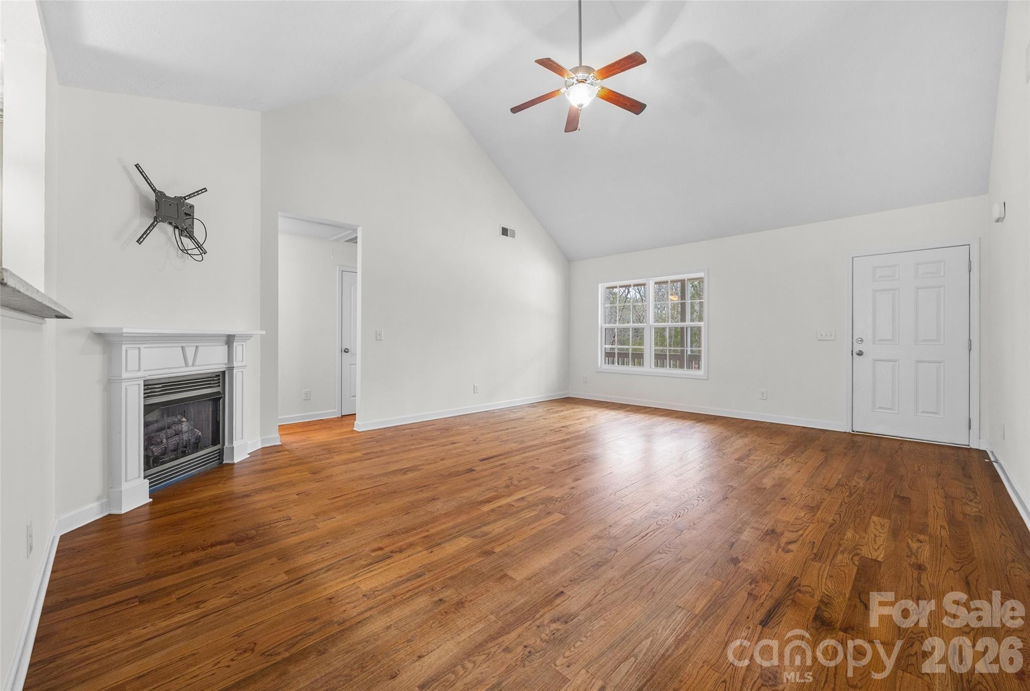 6115 Chandler Road Clover, SC 29710 - Photo 8 of 36 a view of empty room with wooden floor and fan