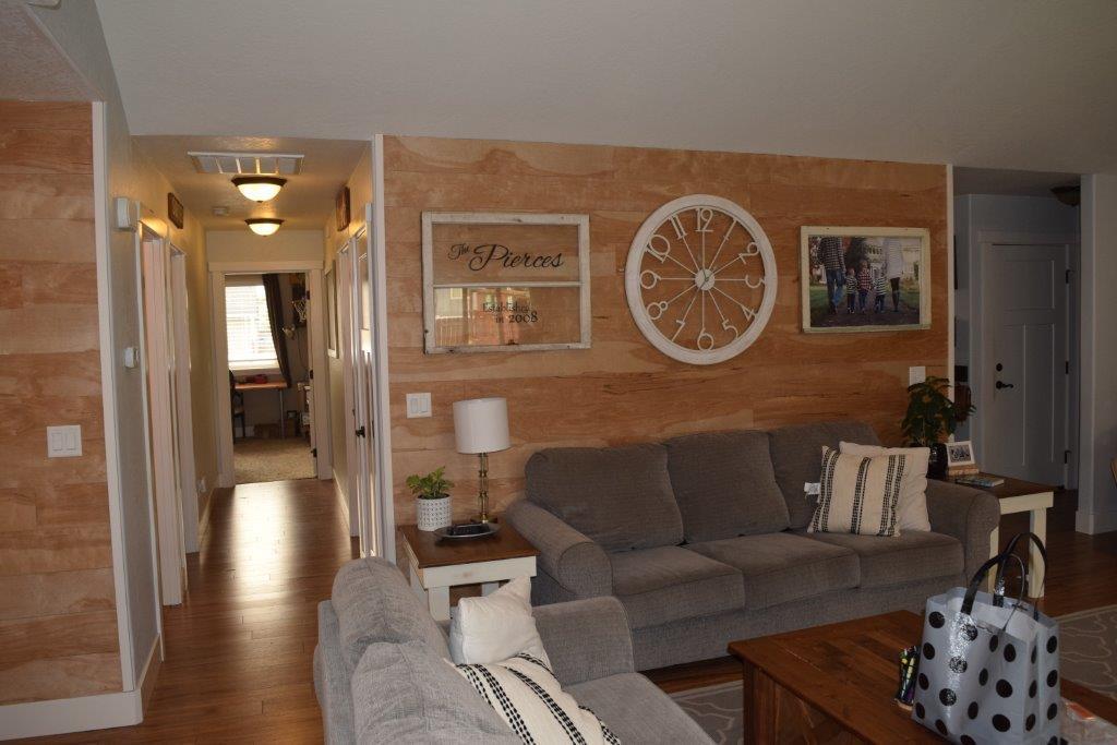 906 Win Way Eagle Point, OR 97524 - Photo 13 of 33 a living room with furniture and a clock