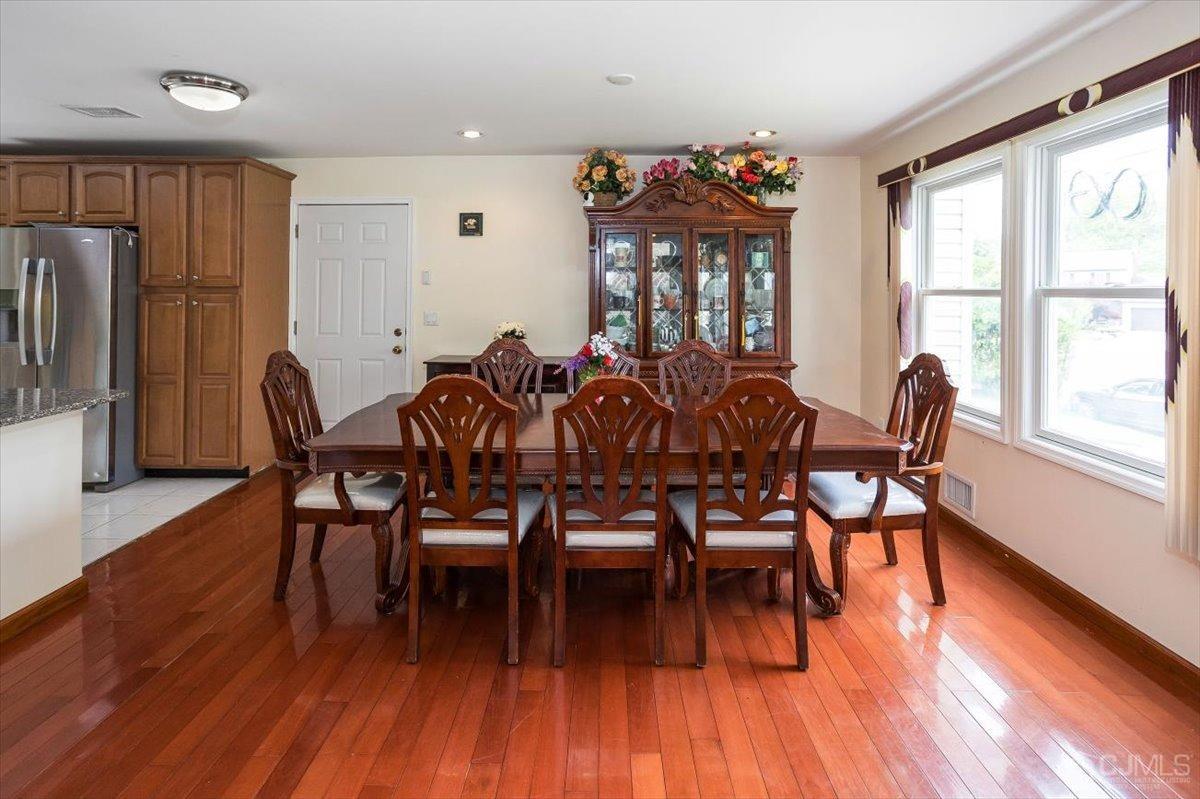 19 Elizabeth Avenue Edison, NJ 08820 - Photo 11 of 48 a view of a dining room with furniture window and wooden floor