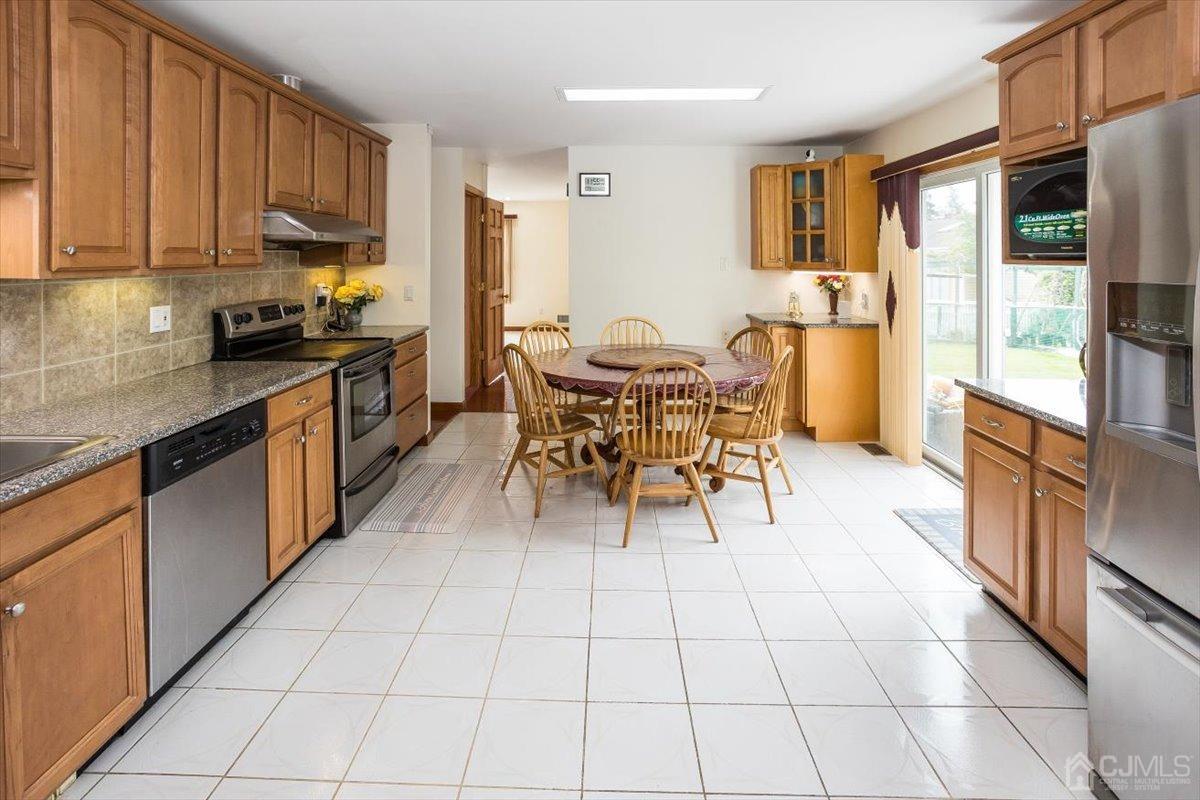 19 Elizabeth Avenue Edison, NJ 08820 - Photo 16 of 48 a kitchen with stainless steel appliances a sink counter space and a window