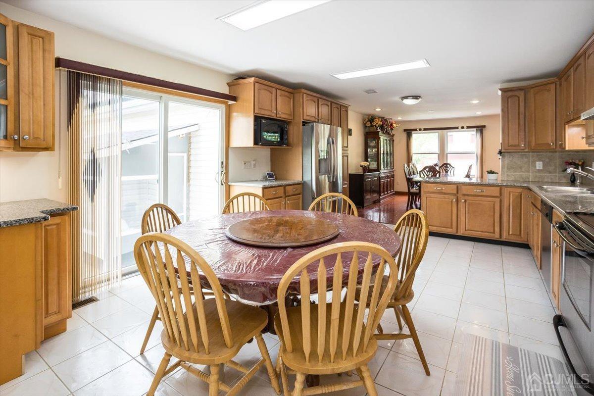 19 Elizabeth Avenue Edison, NJ 08820 - Photo 17 of 48 a view of a dining room with furniture window and outside view