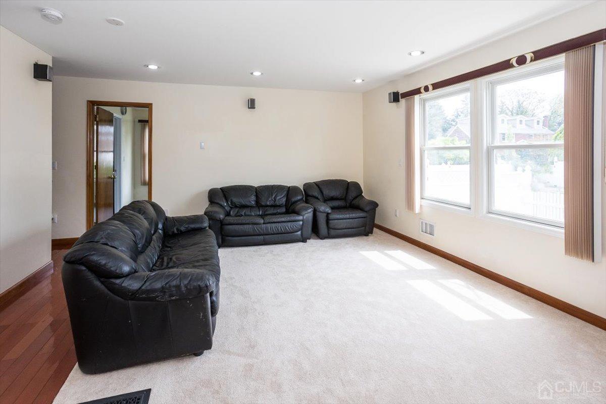 19 Elizabeth Avenue Edison, NJ 08820 - Photo 18 of 48 a living room with furniture window and a flat screen tv