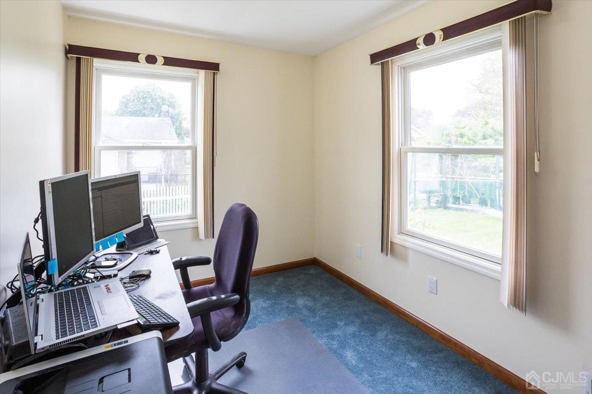 19 Elizabeth Avenue Edison, NJ 08820 - Photo 20 of 48 a view of workspace with wooden floor windows and outdoor view