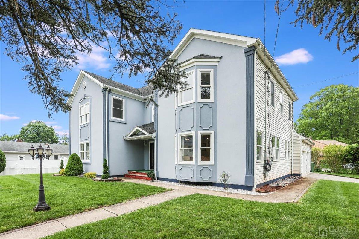 19 Elizabeth Avenue Edison, NJ 08820 - Photo 2 of 48 a view of a house with a yard