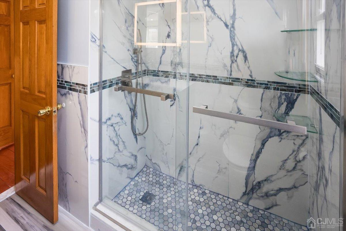 19 Elizabeth Avenue Edison, NJ 08820 - Photo 24 of 48 a bathroom with a shower