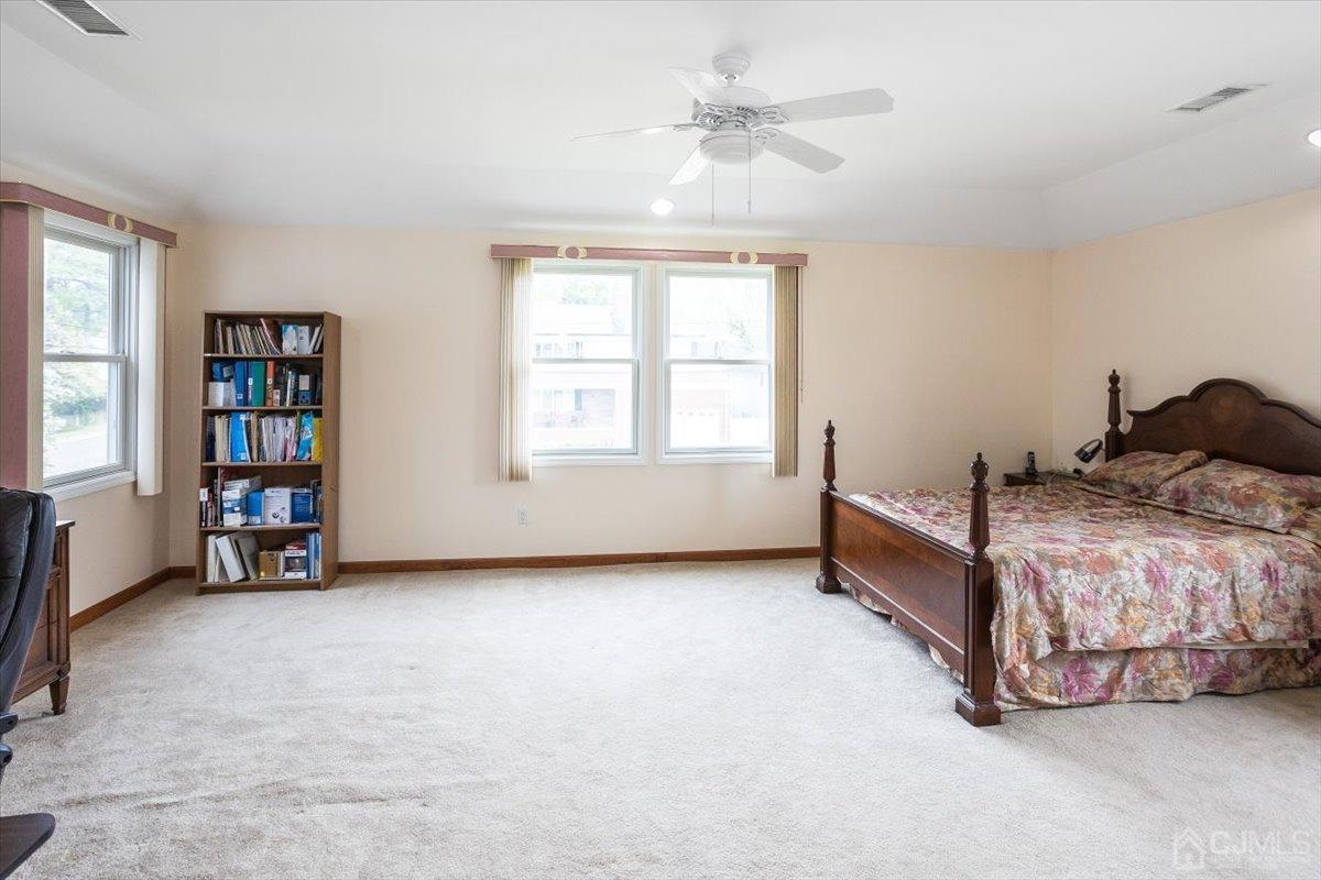 19 Elizabeth Avenue Edison, NJ 08820 - Photo 27 of 48 a bedroom with furniture and a window
