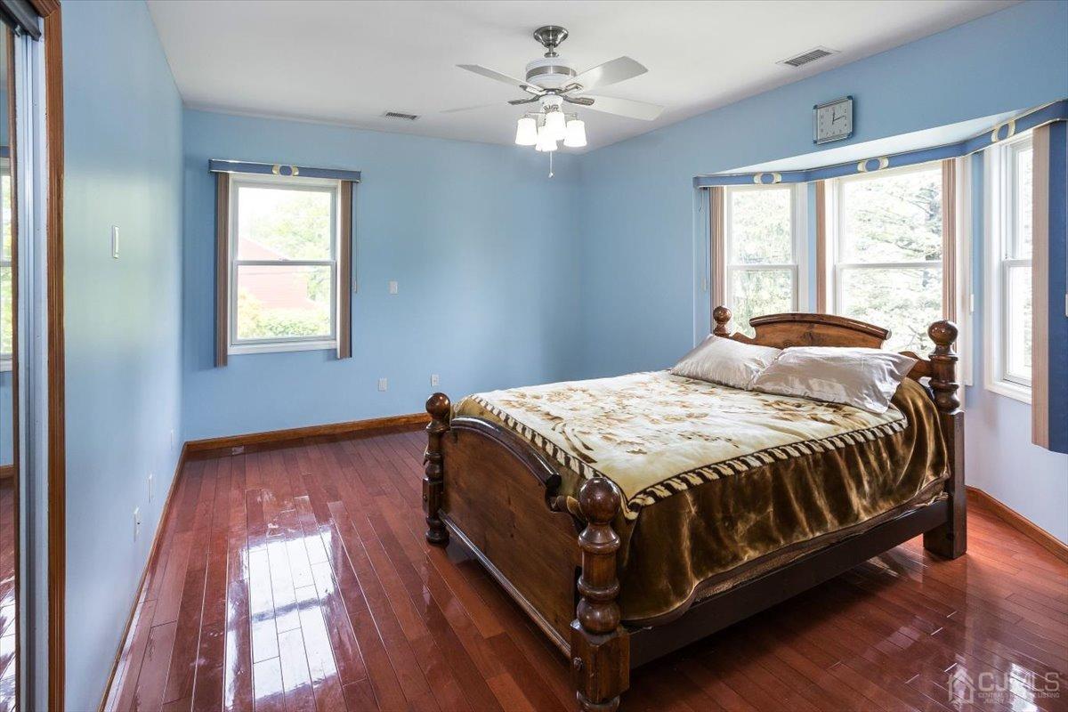 19 Elizabeth Avenue Edison, NJ 08820 - Photo 30 of 48 a spacious bedroom with a bed and a window