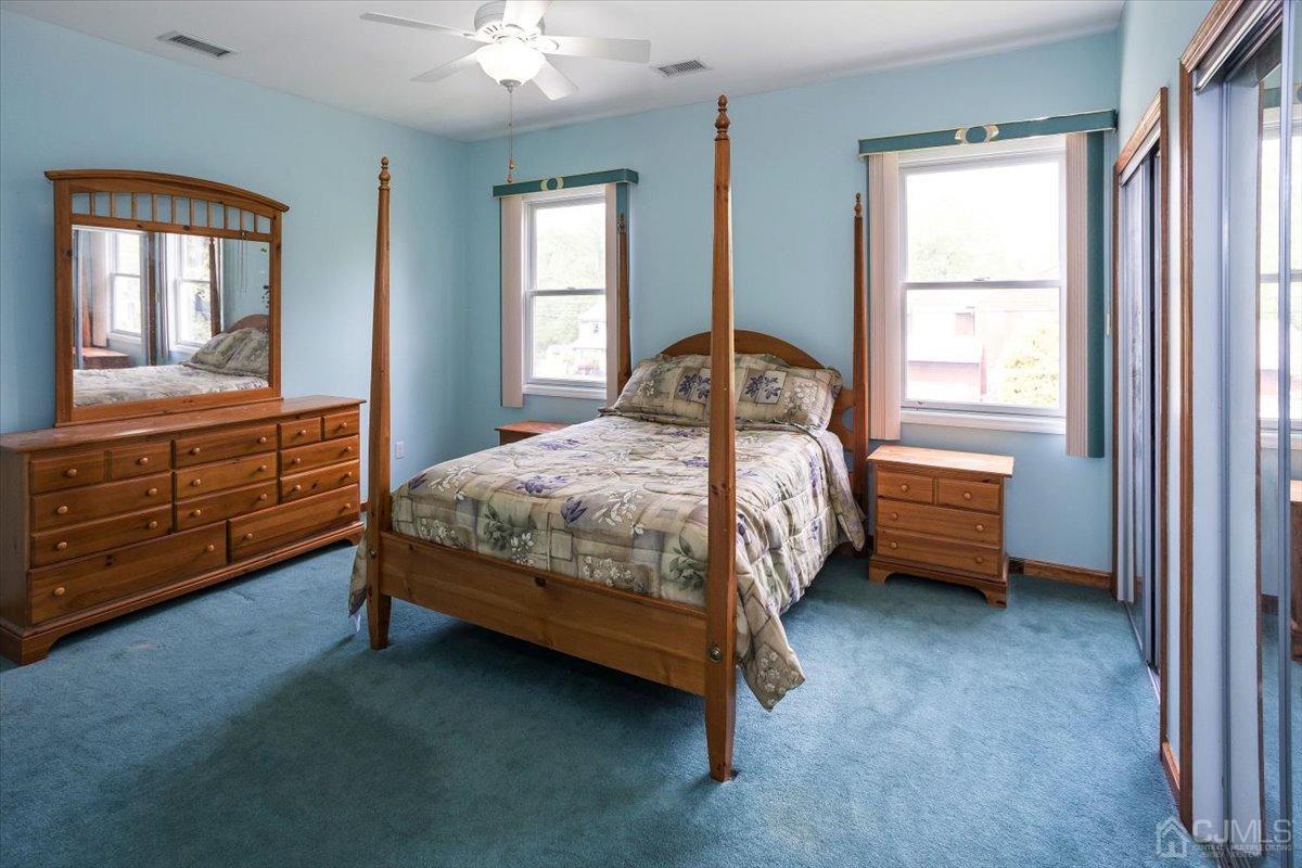 19 Elizabeth Avenue Edison, NJ 08820 - Photo 31 of 48 a bedroom with a bed dresser and a window