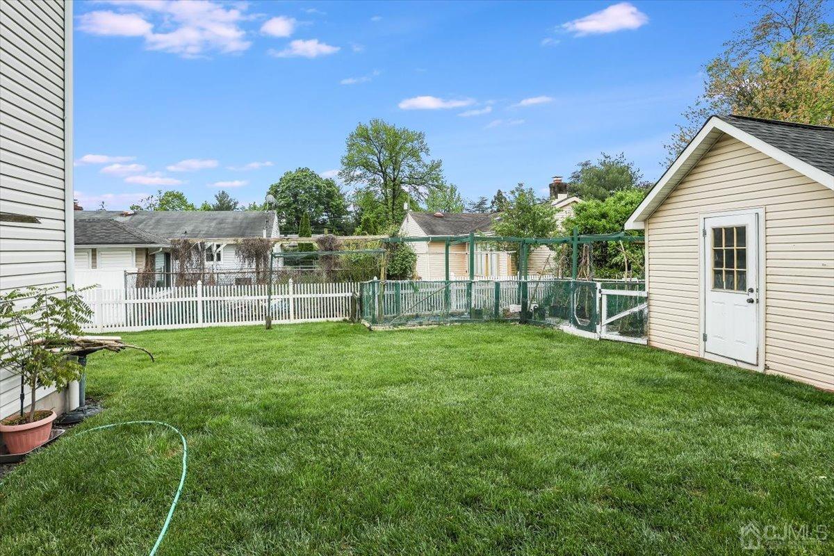 19 Elizabeth Avenue Edison, NJ 08820 - Photo 35 of 48 a view of a house with backyard and a garden