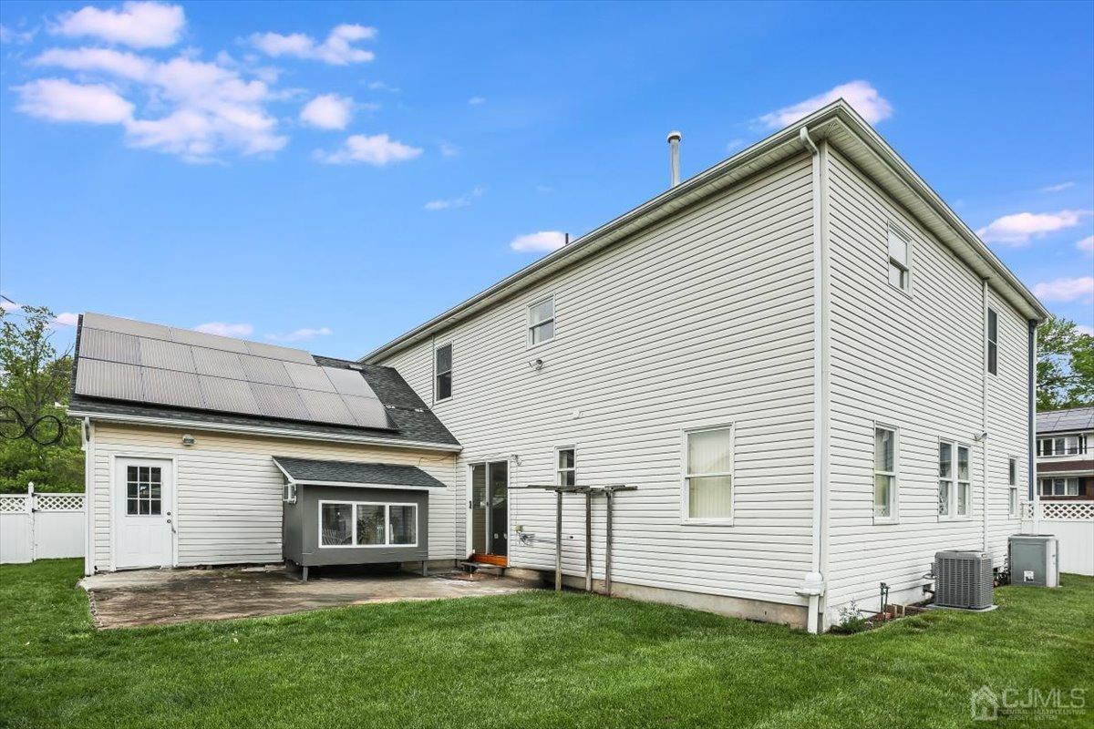 19 Elizabeth Avenue Edison, NJ 08820 - Photo 36 of 48 a front view of a house with a yard