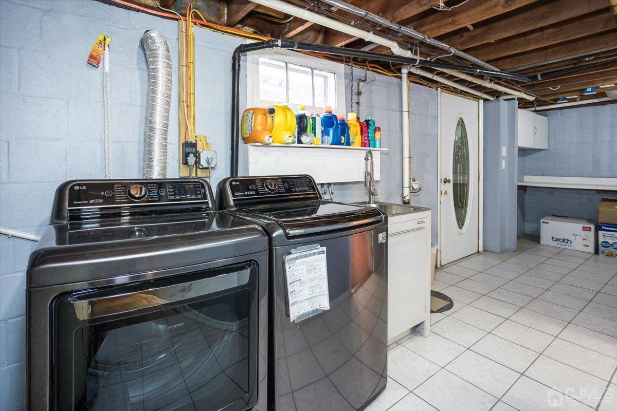 19 Elizabeth Avenue Edison, NJ 08820 - Photo 37 of 48 a kitchen with stainless steel appliances granite countertop a stove and a refrigerator