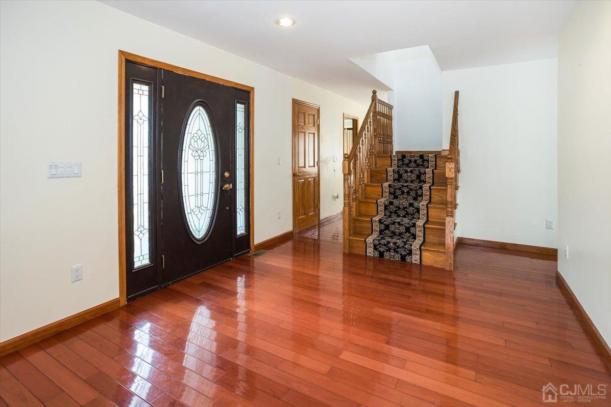 19 Elizabeth Avenue Edison, NJ 08820 - Photo 4 of 48 a view of empty room with wooden floor