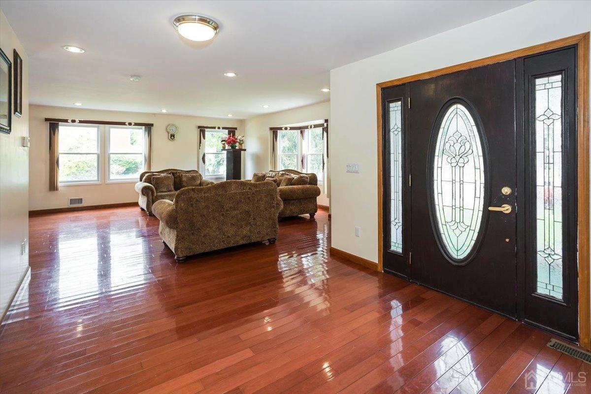 19 Elizabeth Avenue Edison, NJ 08820 - Photo 6 of 48 a living room with furniture and a fireplace