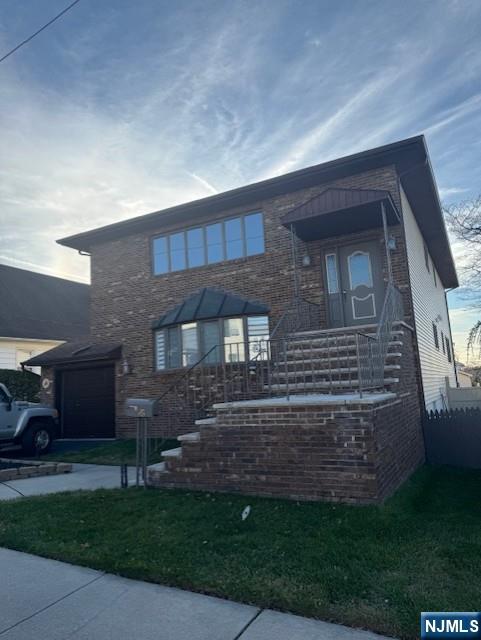 a brick building with a yard in front of it