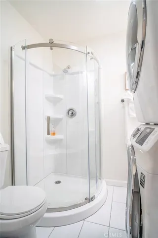 a bathroom with a shower and a toilet