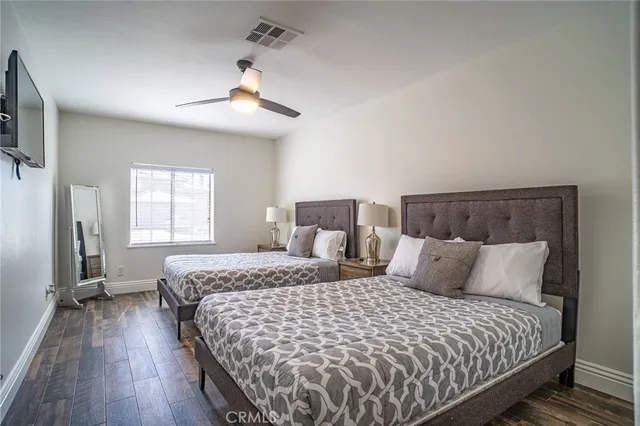 a bedroom with bed and window