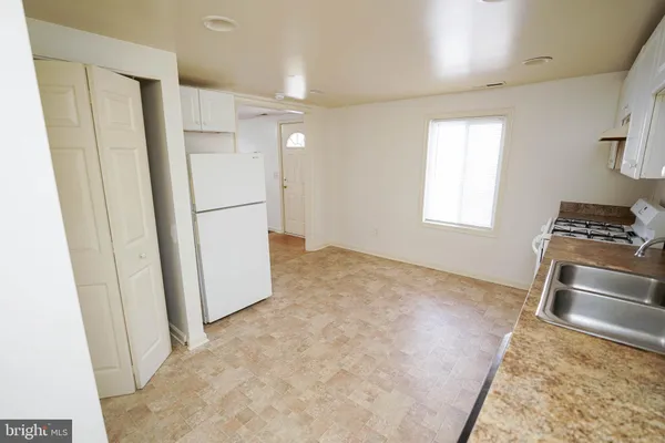 a view of kitchen and front door