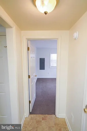 a view of hallway with wooden floor