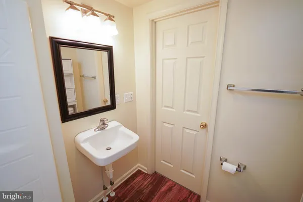 a bathroom with a sink a mirror and shower view