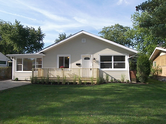 1040 Midway Road Northbrook, IL 60062 - Photo 1 of 18 a front view of a house with a yard