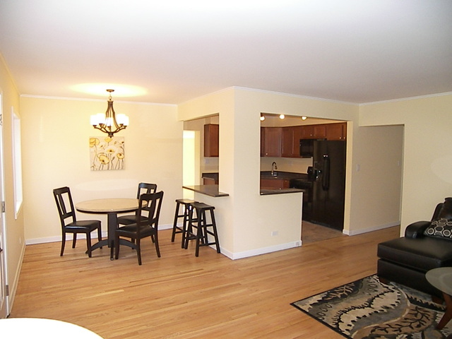 1040 Midway Road Northbrook, IL 60062 - Photo 5 of 18 a view of a dining room with furniture and wooden floor