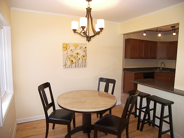 1040 Midway Road Northbrook, IL 60062 - Photo 6 of 18 a view of a dining room with furniture and wooden floor