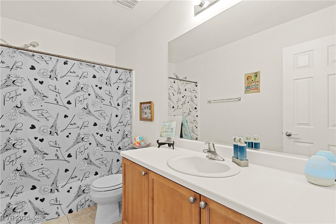 9105 Silk Threads Avenue Las Vegas, NV 89149 - Photo 18 of 25 Guest Bathroom featuring vanity, a shower/tub combo