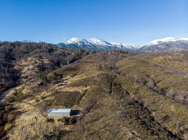 a view of a city with mountains in the background